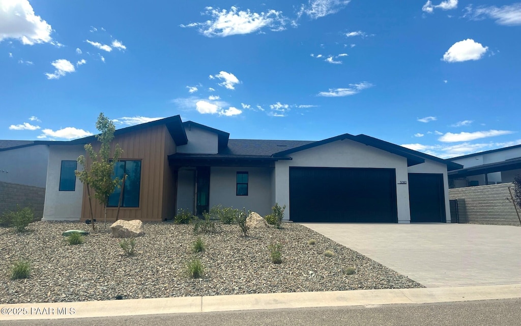 5080 N Jeffers Ave, Prescott Valley, AZ 86314 - view of front of house featuring driveway, a garage, and stucco siding