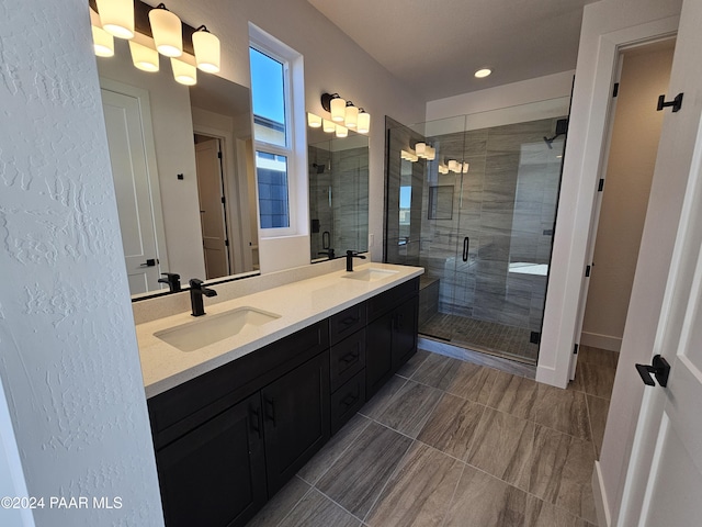 bathroom with vanity and an enclosed shower