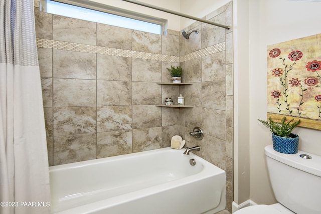 bathroom with shower / bathtub combination with curtain and toilet