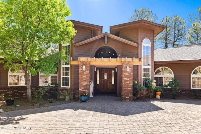 1167 Eagles Nest, Prescott, AZ 86303 - entrance to property featuring brick siding and curved driveway