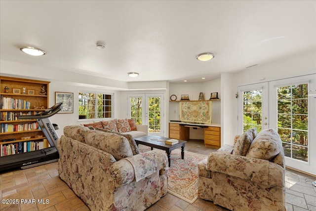 1167 Eagles Nest, Prescott, AZ 86303 - living area with french doors, plenty of natural light, and stone tile flooring