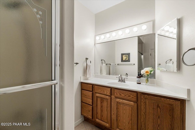 1167 Eagles Nest, Prescott, AZ 86303 - bathroom featuring a shower with shower door, vanity, and tile patterned flooring