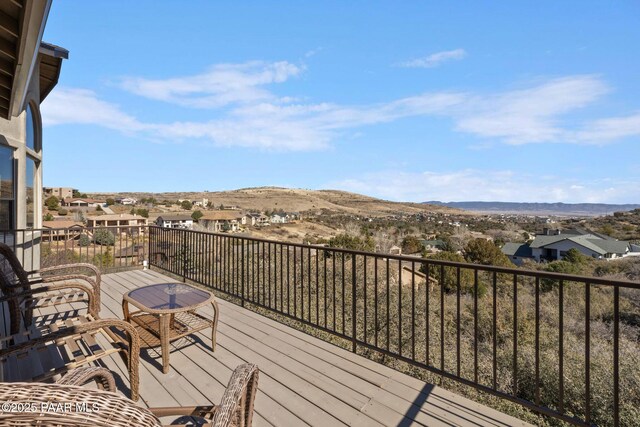 balcony with a mountain view and a residential view