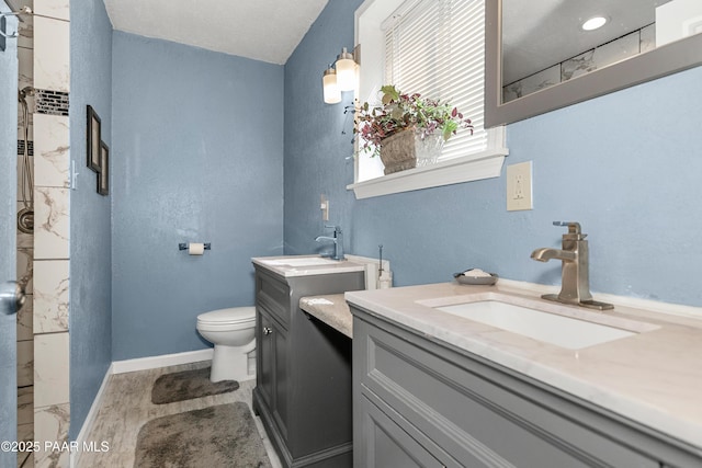 1116 Christie Ln, Prescott, AZ 86305 - bathroom featuring baseboards, toilet, a shower, vanity, and wood finished floors