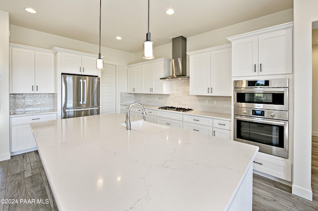 12290 N Thrine Cir, Prescott, AZ 86305 - kitchen with white cabinetry, a sink, wall chimney exhaust hood, and appliances with stainless steel finishes