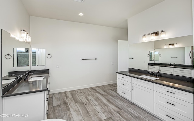 12290 N Thrine Cir, Prescott, AZ 86305 - full bath featuring wood finished floors, a sink, and two vanities