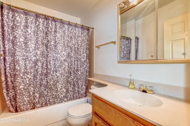 bathroom with toilet, shower / bath combo, and vanity