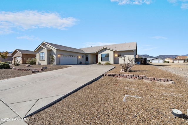 ranch-style home featuring a garage