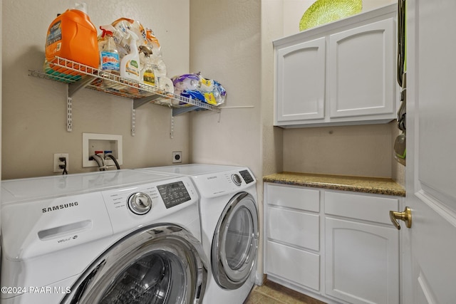 washroom with cabinets and independent washer and dryer