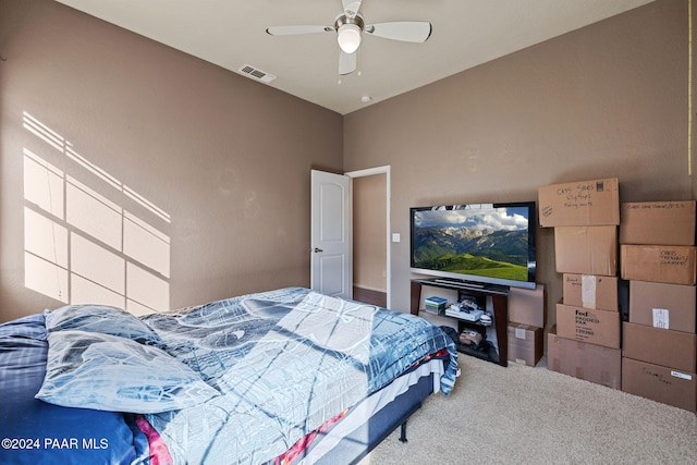 bedroom with ceiling fan and carpet floors