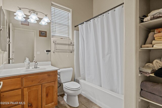 full bathroom featuring tile patterned floors, vanity, toilet, and shower / bath combo