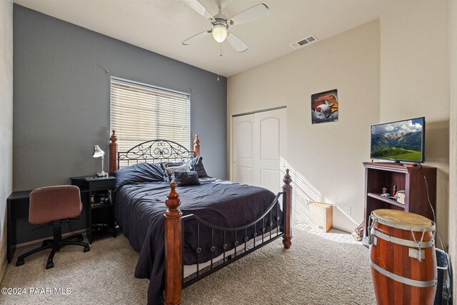 bedroom featuring ceiling fan, carpet floors, and a closet