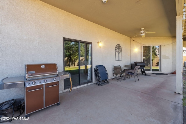 view of patio / terrace with ceiling fan and area for grilling