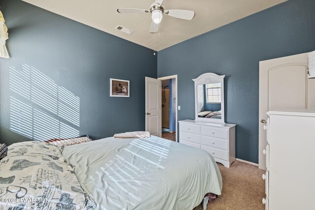 bedroom featuring ceiling fan and light colored carpet