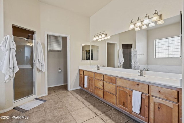 bathroom with vanity and a shower with shower door