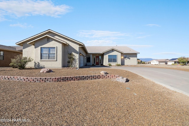 ranch-style house featuring a garage