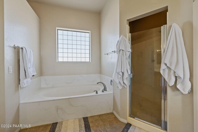 bathroom with shower with separate bathtub