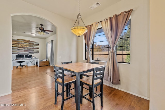 dining area featuring ceiling fan and wood-type flooring