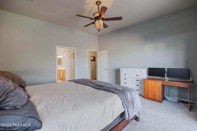 bedroom featuring light colored carpet, ceiling fan, and ensuite bathroom