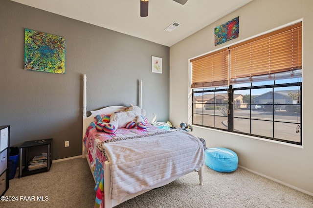 bedroom featuring ceiling fan and carpet