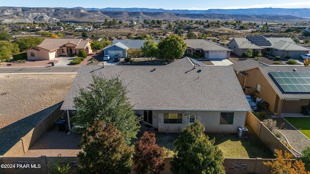 birds eye view of property with a mountain view