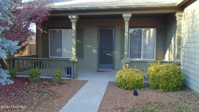 doorway to property featuring a porch