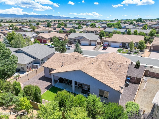 birds eye view of property with a residential view and a mountain view