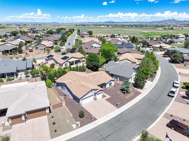 birds eye view of property with a residential view and a mountain view