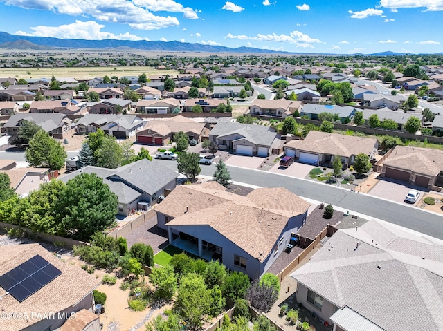 birds eye view of property with a mountain view and a residential view