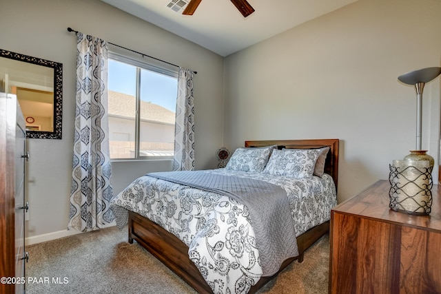 carpeted bedroom featuring visible vents, a ceiling fan, and baseboards