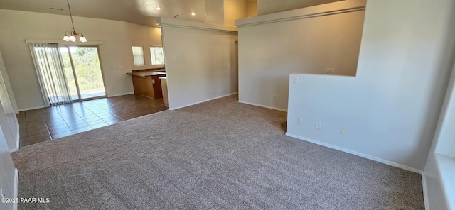 10919 E Roundup Dr, Dewey-Humboldt, AZ 86327 - tiled spare room with carpet, a chandelier, and lofted ceiling