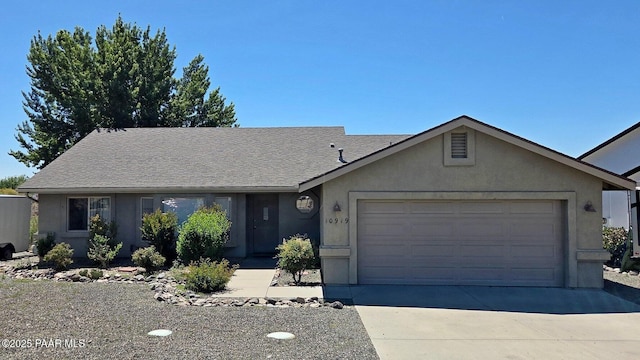 10919 E Roundup Dr, Dewey-Humboldt, AZ 86327 - single story home featuring an attached garage, stucco siding, concrete driveway, and a shingled roof
