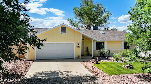 5420 N Mesquite Dr, Prescott Valley, AZ 86314 - view of front of house featuring an attached garage, a shingled roof, concrete driveway, and a front lawn