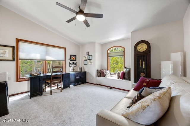 carpeted living room featuring vaulted ceiling and ceiling fan