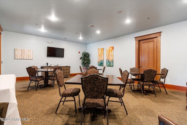 view of carpeted dining space