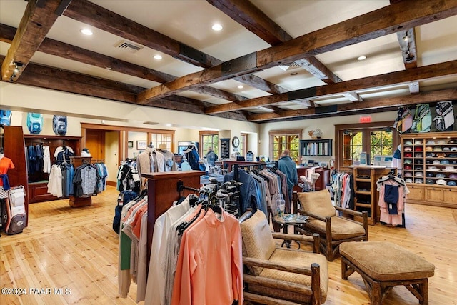 misc room featuring beam ceiling, light hardwood / wood-style flooring, and french doors