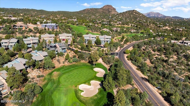 birds eye view of property with a mountain view