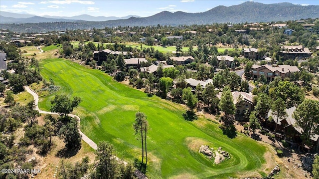 birds eye view of property with a mountain view