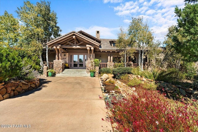 craftsman-style house featuring french doors