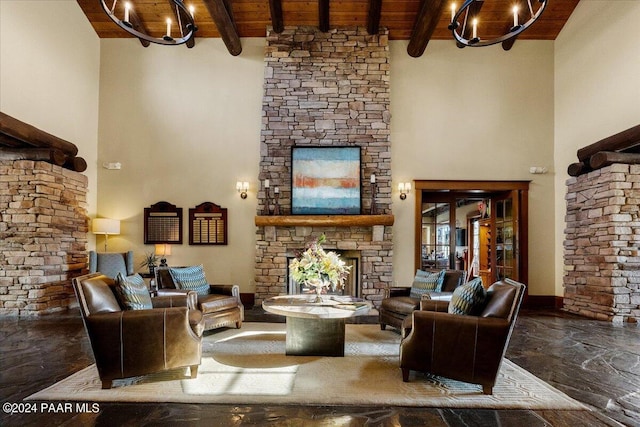 living room with beamed ceiling, a notable chandelier, wooden ceiling, and a fireplace