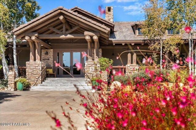 back of property featuring french doors