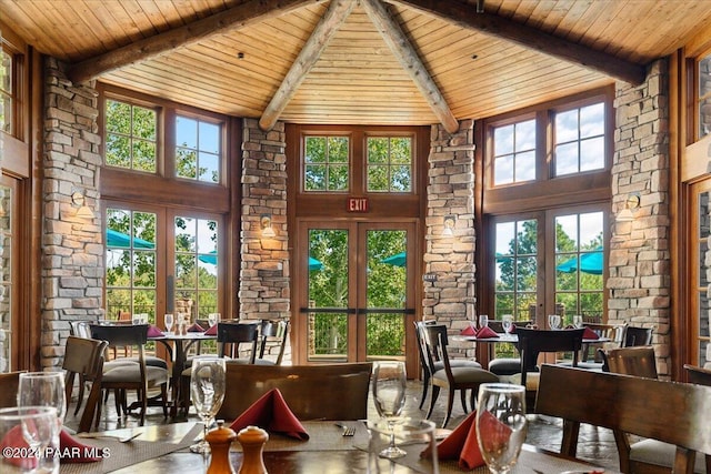 dining room with wood ceiling, high vaulted ceiling, and french doors