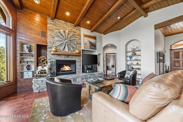 living room featuring hardwood / wood-style floors, high vaulted ceiling, plenty of natural light, and wooden ceiling