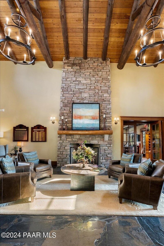 living room with a fireplace, beam ceiling, and wood ceiling