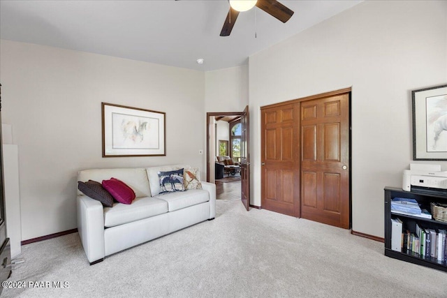 living room with ceiling fan and light carpet