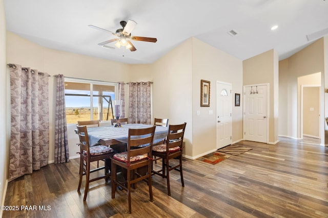 dining space with dark hardwood / wood-style flooring and ceiling fan