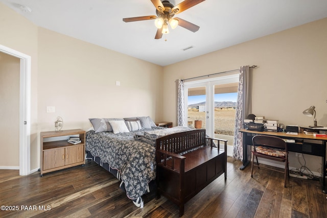 bedroom with ceiling fan and dark hardwood / wood-style flooring