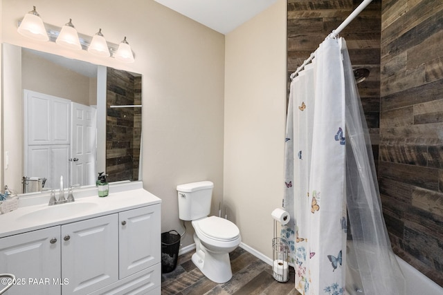 bathroom featuring a shower with curtain, hardwood / wood-style floors, vanity, and toilet