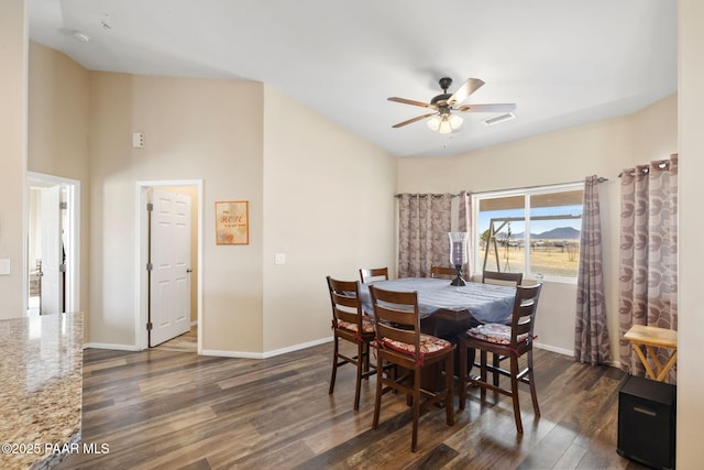 dining space with ceiling fan and dark hardwood / wood-style floors