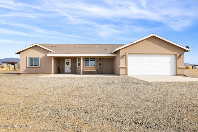 single story home featuring a garage